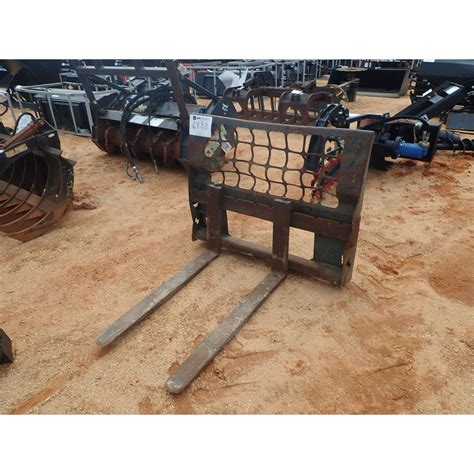 skid steer attachment holder|used cat attachments for sale.